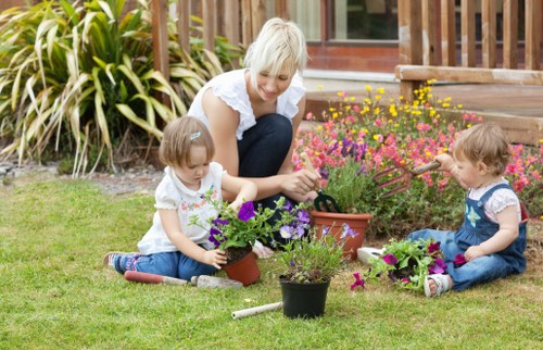 Gardener inspecting a residential garden bed